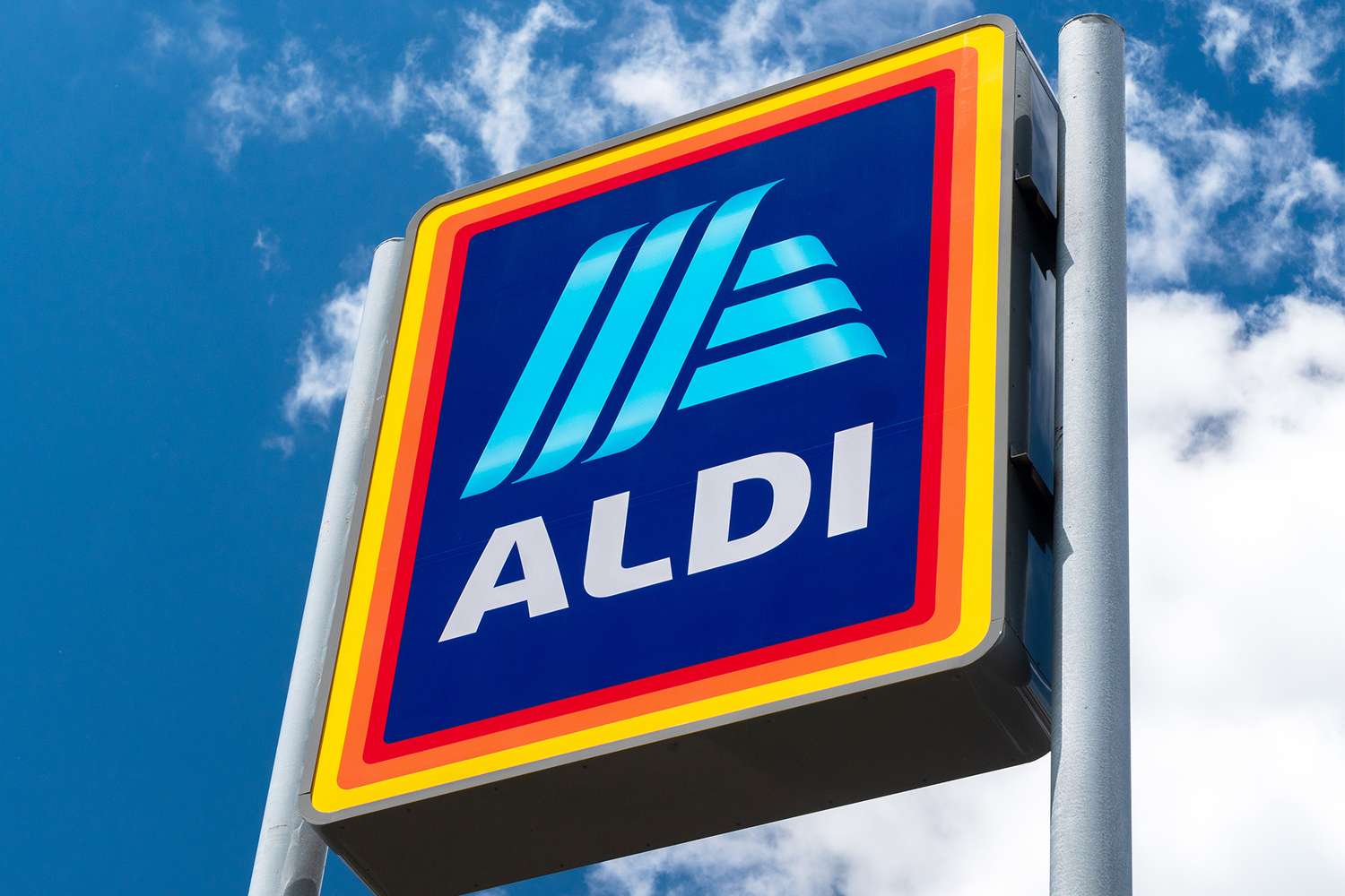 Aldi store sign against a cloudy sky