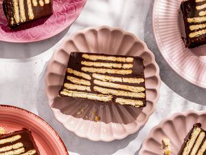 Overhead shot of pink plates with slices of German hedgehog slice cake