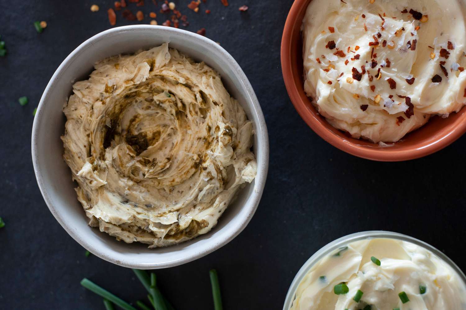 Close up shot of mixed compound butter in bowls
