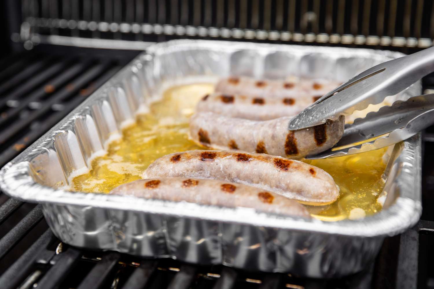 Beer Brats Flipped Using Tongs