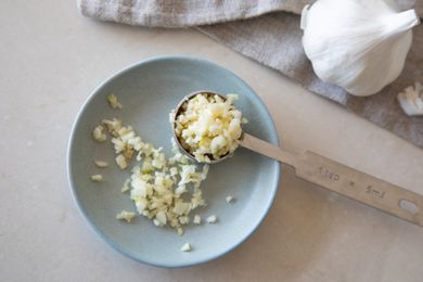 Minced garlic on a blue plate