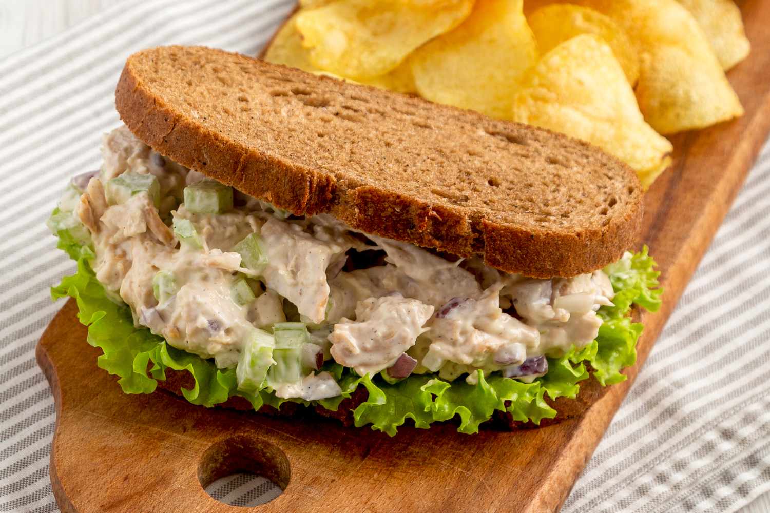Chicken Salad Sandwich with Potato Chips, side view