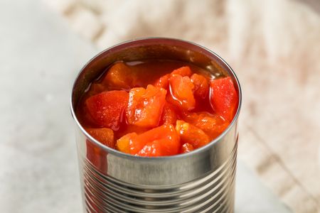 A can of diced tomatoes on a surface