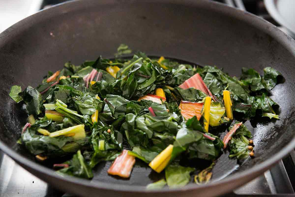 Swiss chard cooked down in a pan