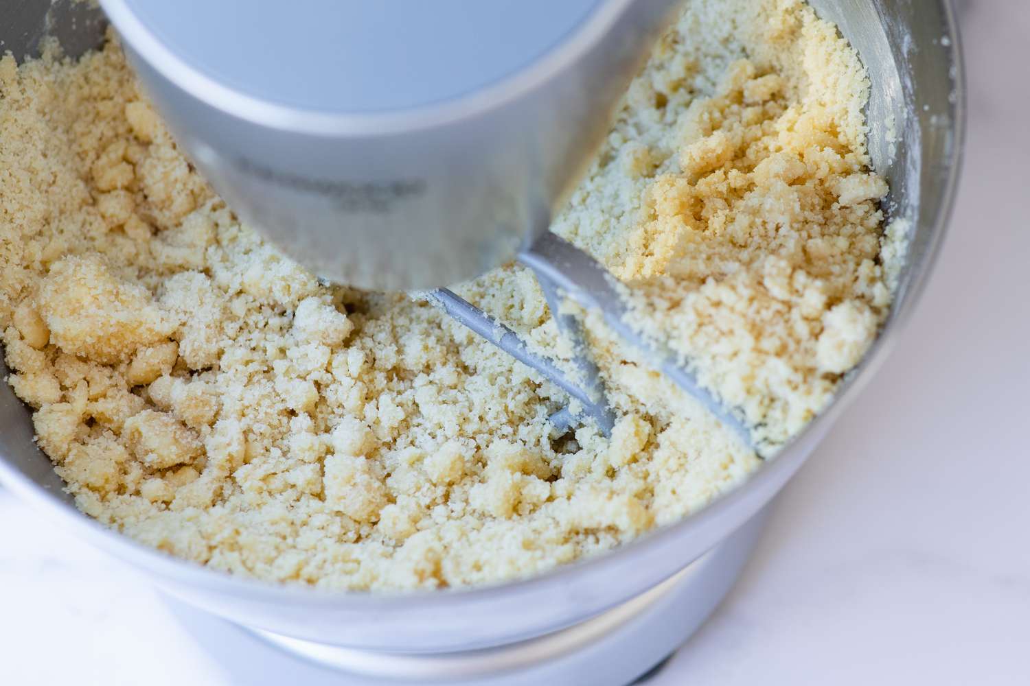 Making an almond cookie recipe in a stand mixer.