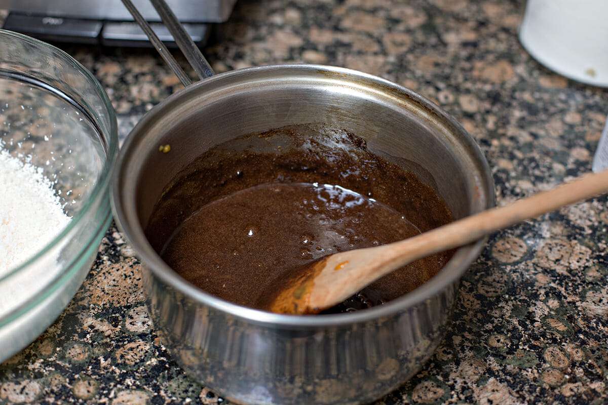 Stirring chocolate macaroon batter