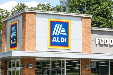 Exterior view of an Aldi grocery store, storefront with Aldi logo