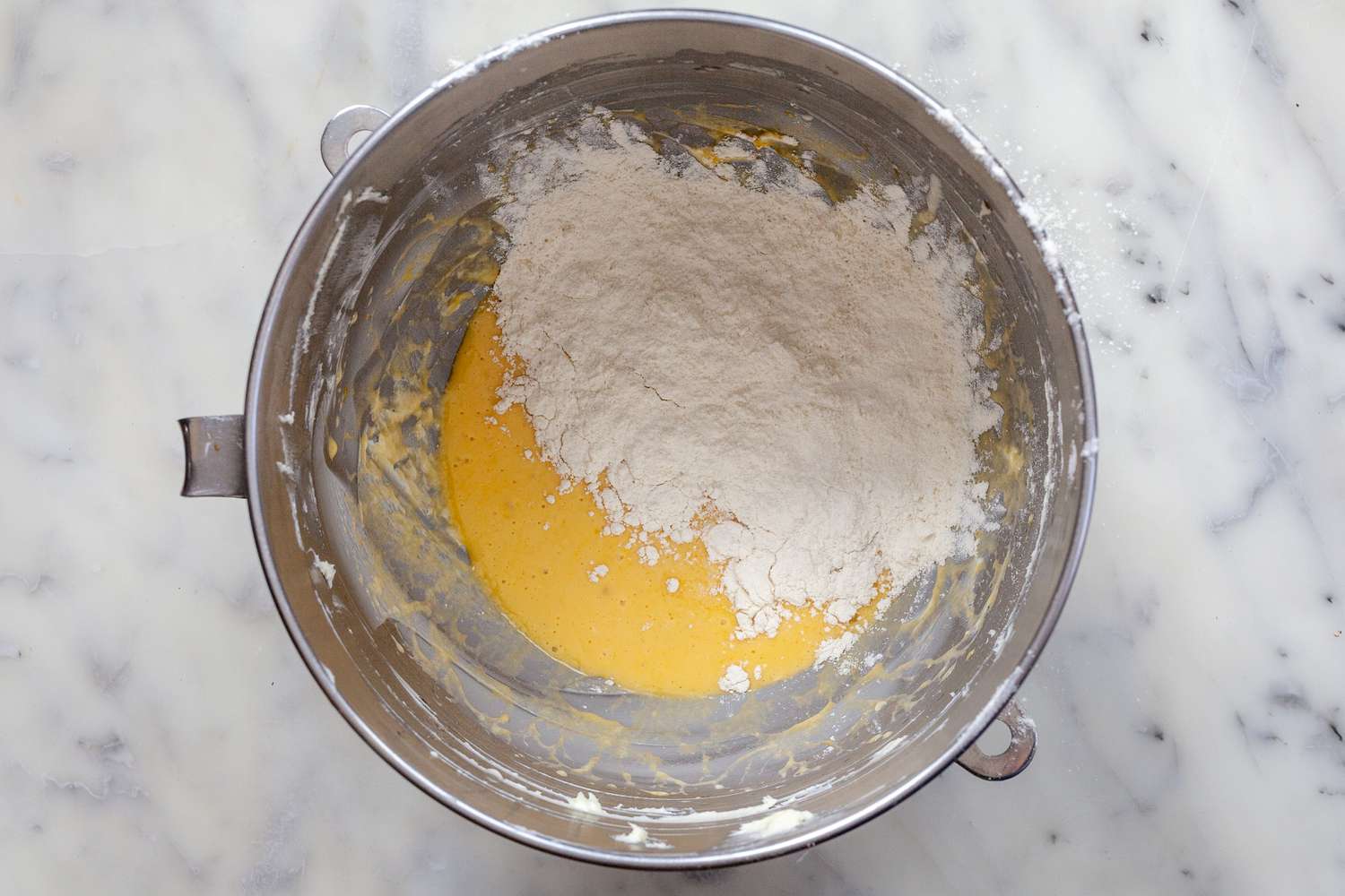 Ingredients in a mixer for the ultimate brioche buns for hamburgers.