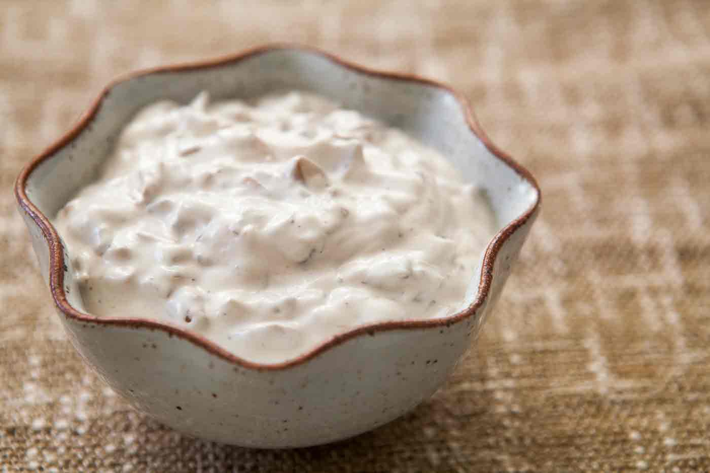 French Onion Dip in a scalloped bowl