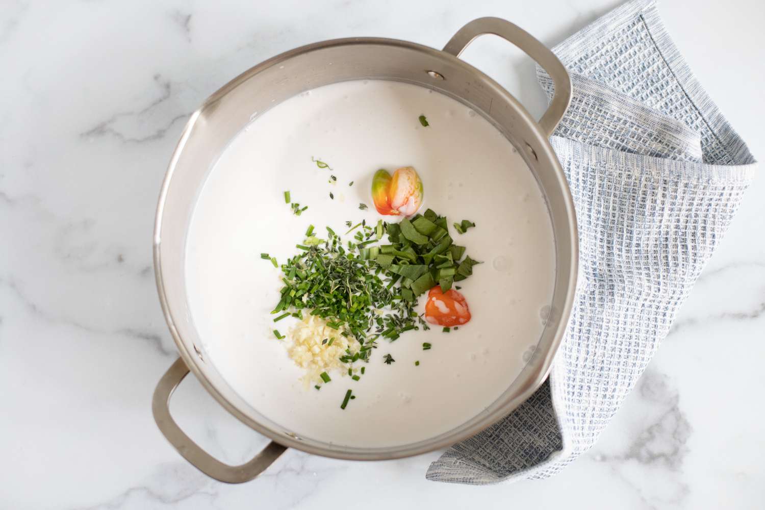 Pot with Coconut Milk, Minced Ingredients, and Habanero Peppers for Trinidadian Corn Recipe