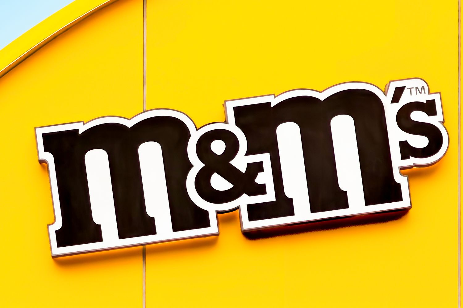 The MMs logo on a yellow background