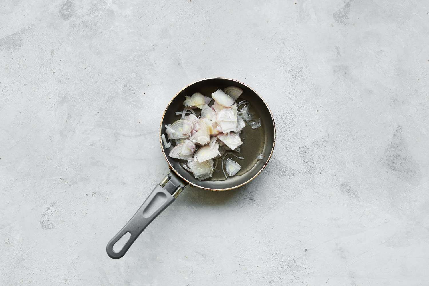 Shallots in Pan with Oil for Chào Gá (Vietnamese Rice Porridge)