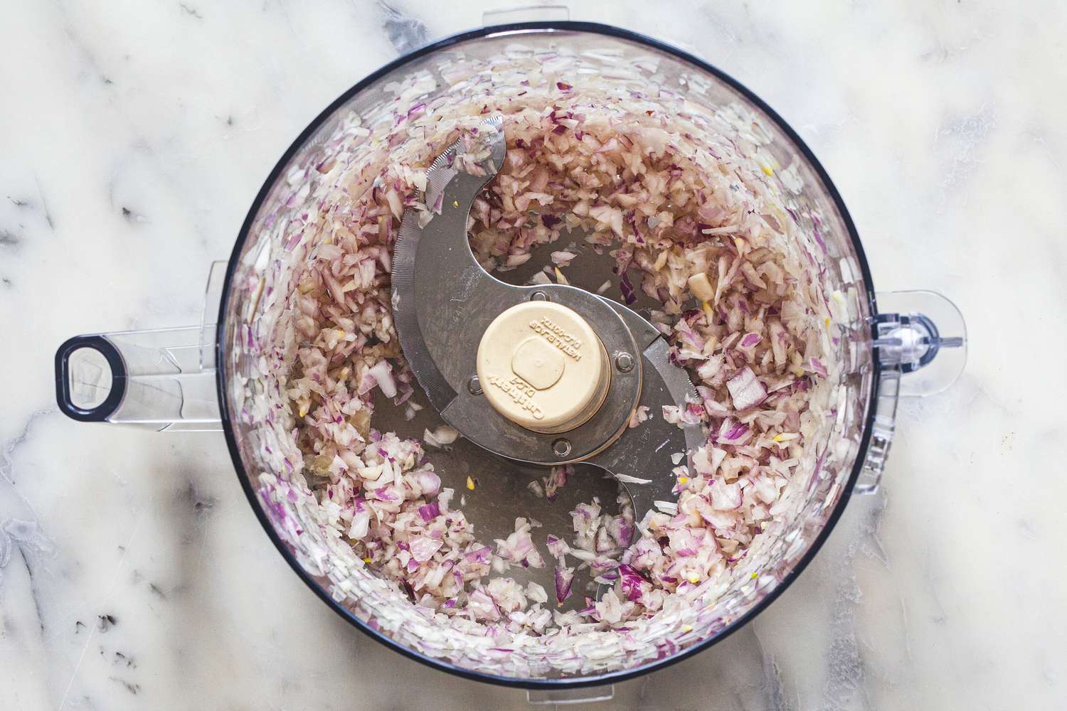 Food processor making a mignonette sauce.
