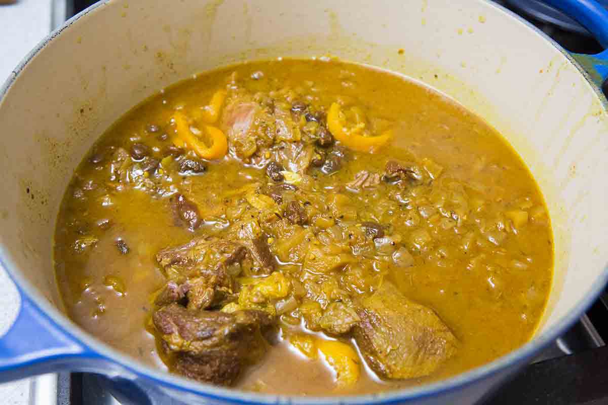 lamb curry being cooked in pot