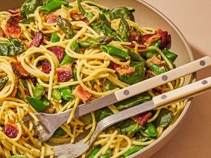 large bowl of Spring Carbonara with serving spoon and fork