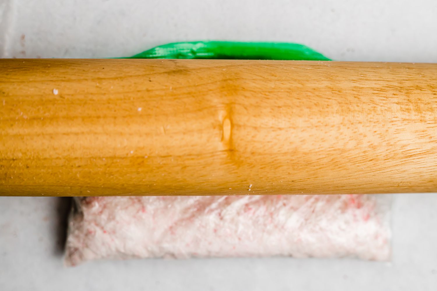 Crushing peppermints to make easy shortbread with chocolate and crushed peppermint.