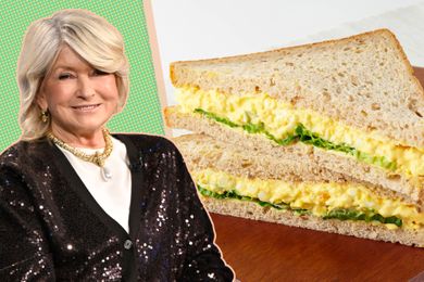 Martha Stewart next to a sandwich with a filling of egg salad and greens