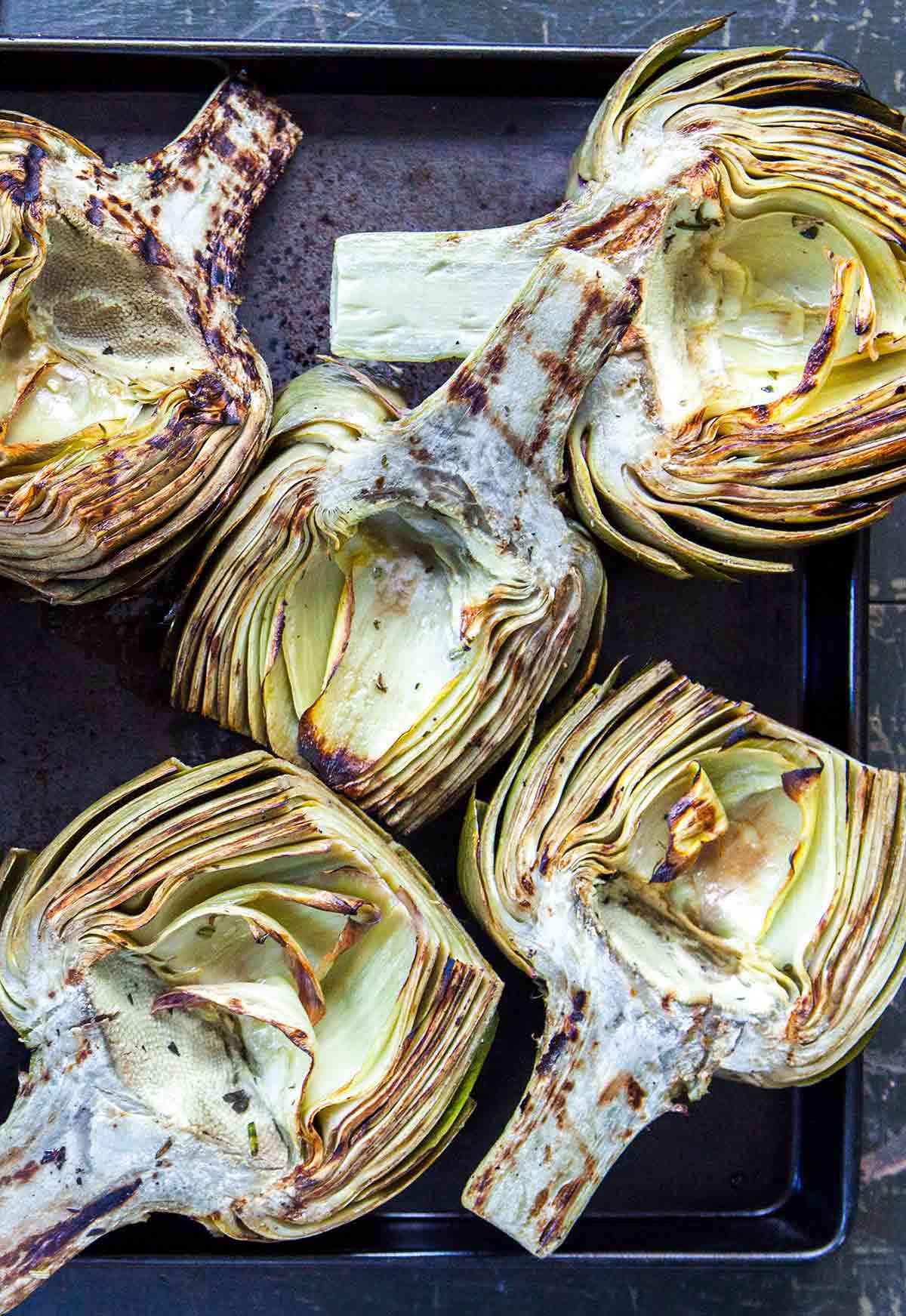 A plate of grilled artichokes