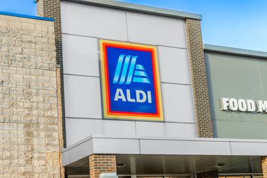Exterior view of an Aldi supermarket store sign on a building