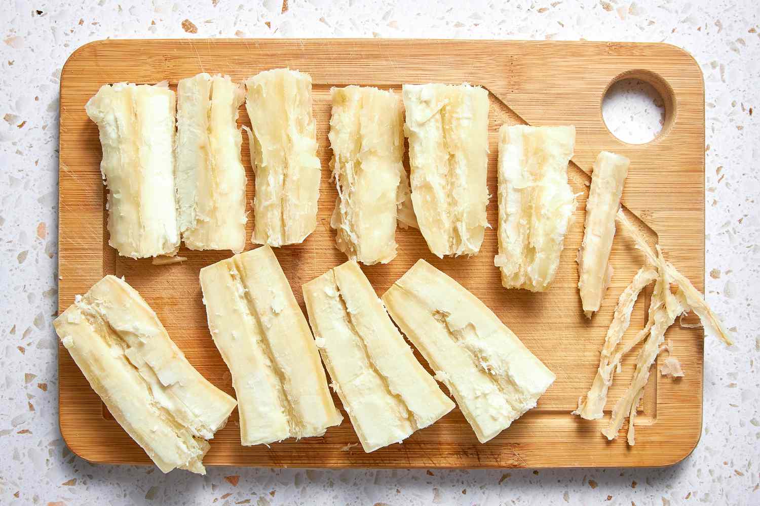 Yuca Roots on a Cutting Board After Removing the Fibrous Core 
