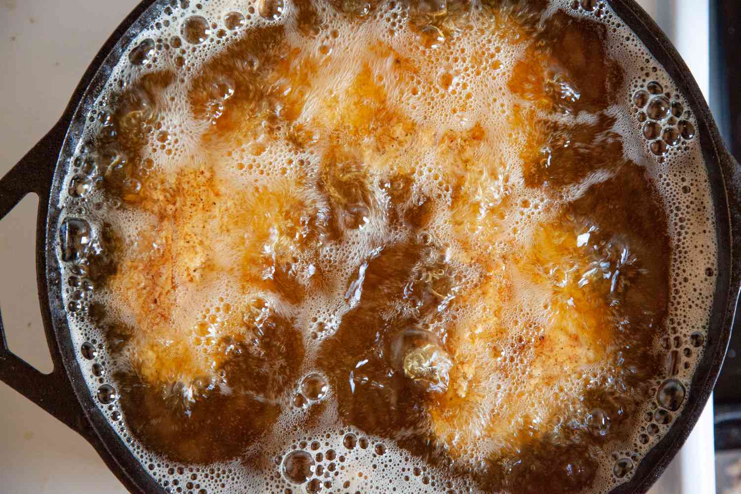 Frying the chicken to make Nashville-style hot chicken.