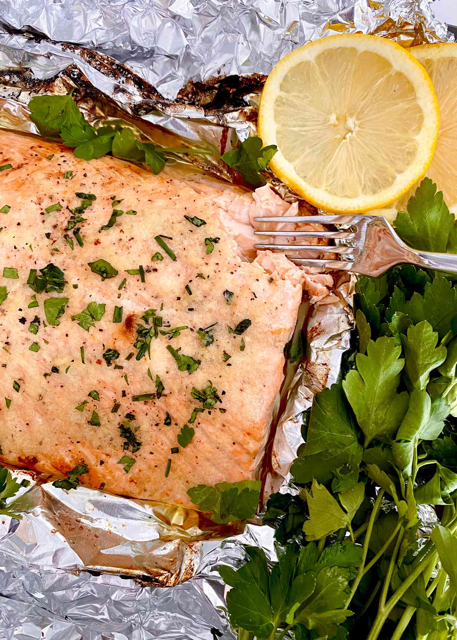 Garlic Butter Baked Salmon with herbs and lemon.