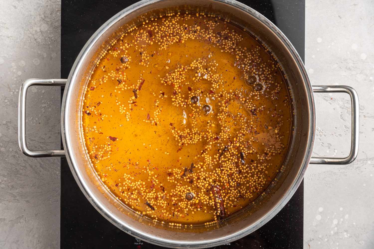 Overhead of Bread and Butter Pickle Brine in a pot