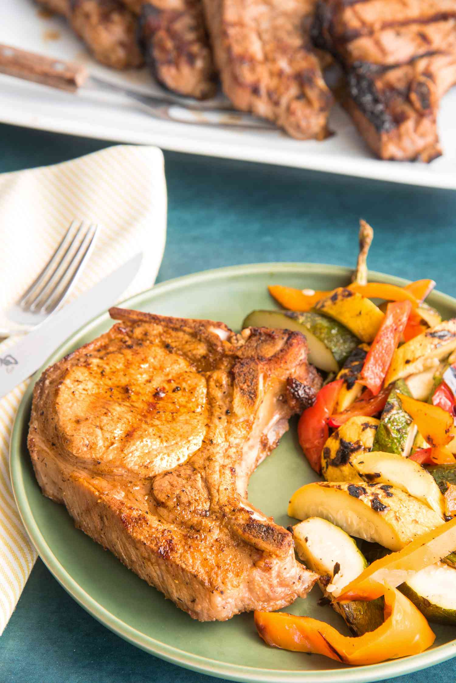 Pork Chop on Plate with Peppers and Squash 