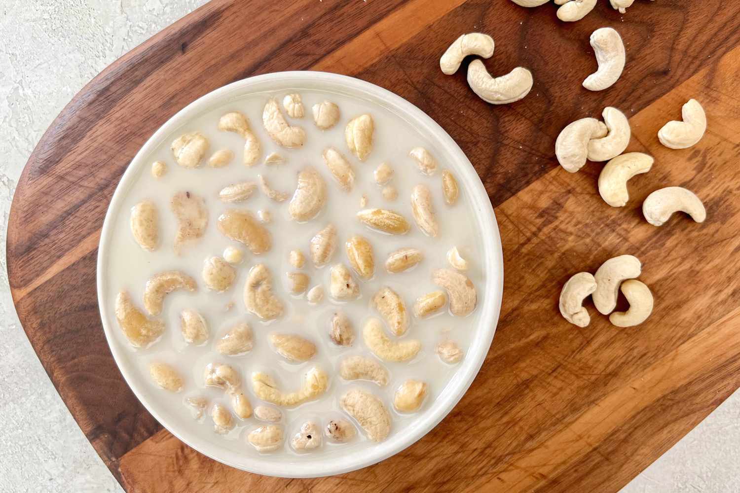 Bowl of Oat Milk and Cashews for Vegan Creamed Spinach Recipe