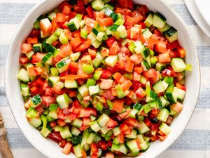 A bowl of pipirrana salad featuring diced cucumbers tomatoes and peppers