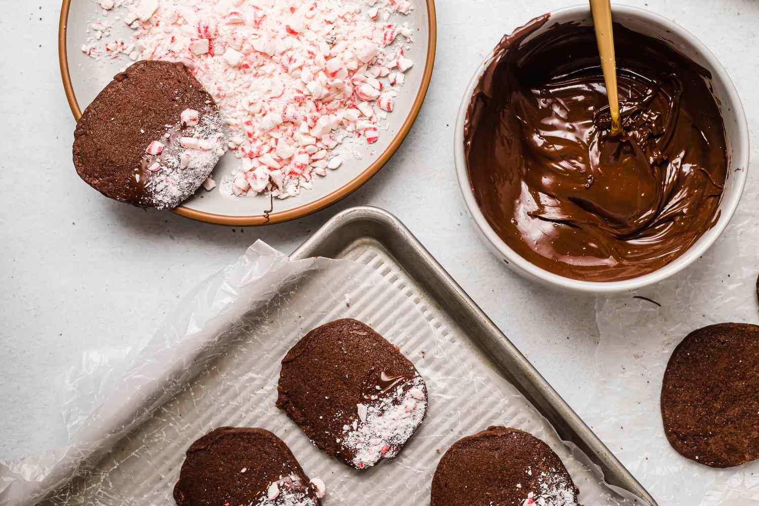Chocolate shortbread cookies dipped in chocolate and peppermint pieces.