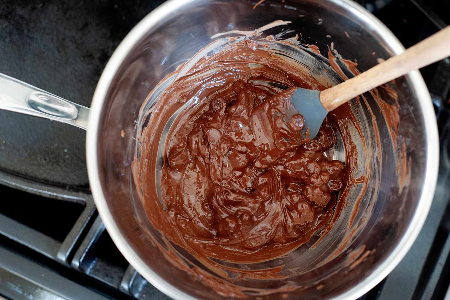 Making a chocolate ice cream recipe on the stove.
