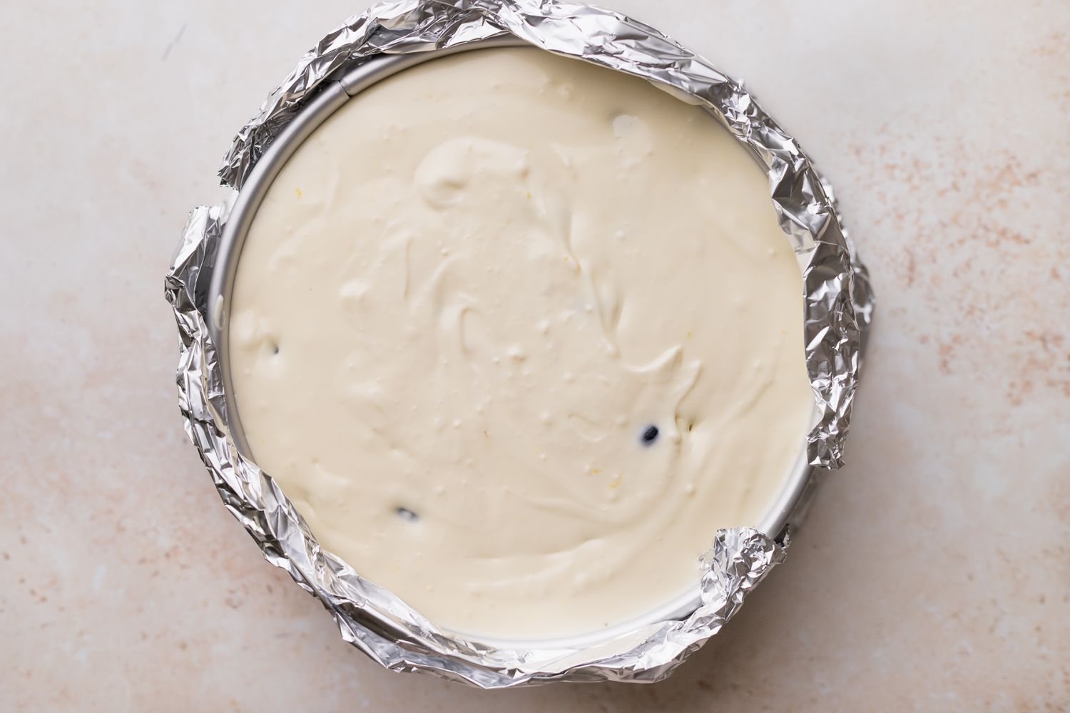 Pour cheesecake mixture into prepared pan.