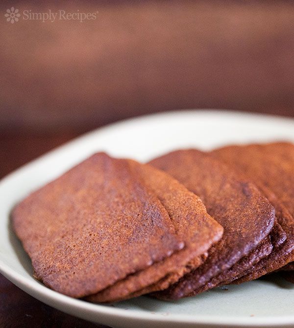 A plate of very thin and crisp gingersnap cookies