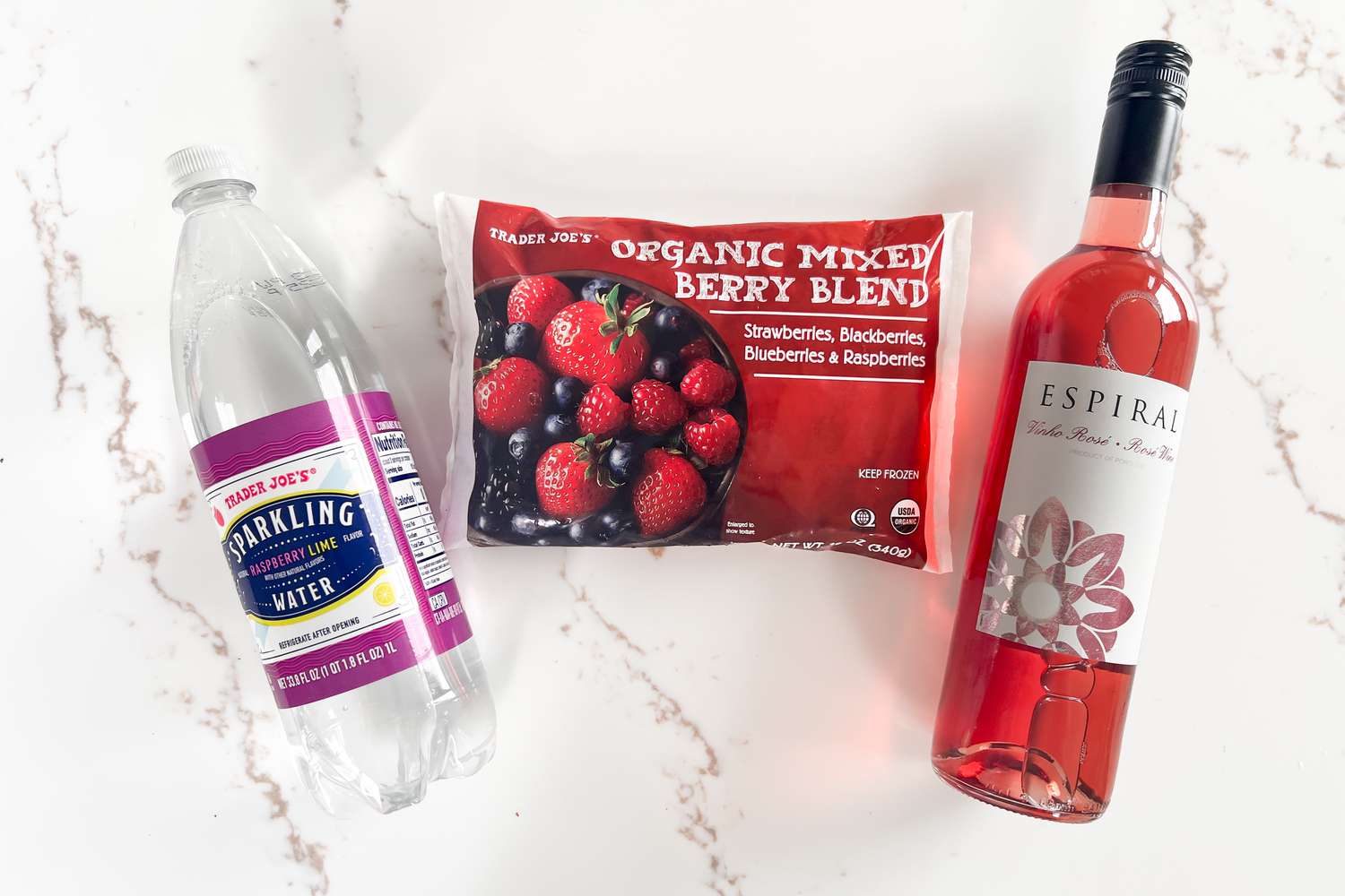 Sparkling water, frozen berry blend, and RosÃ© from Trader Joe's
