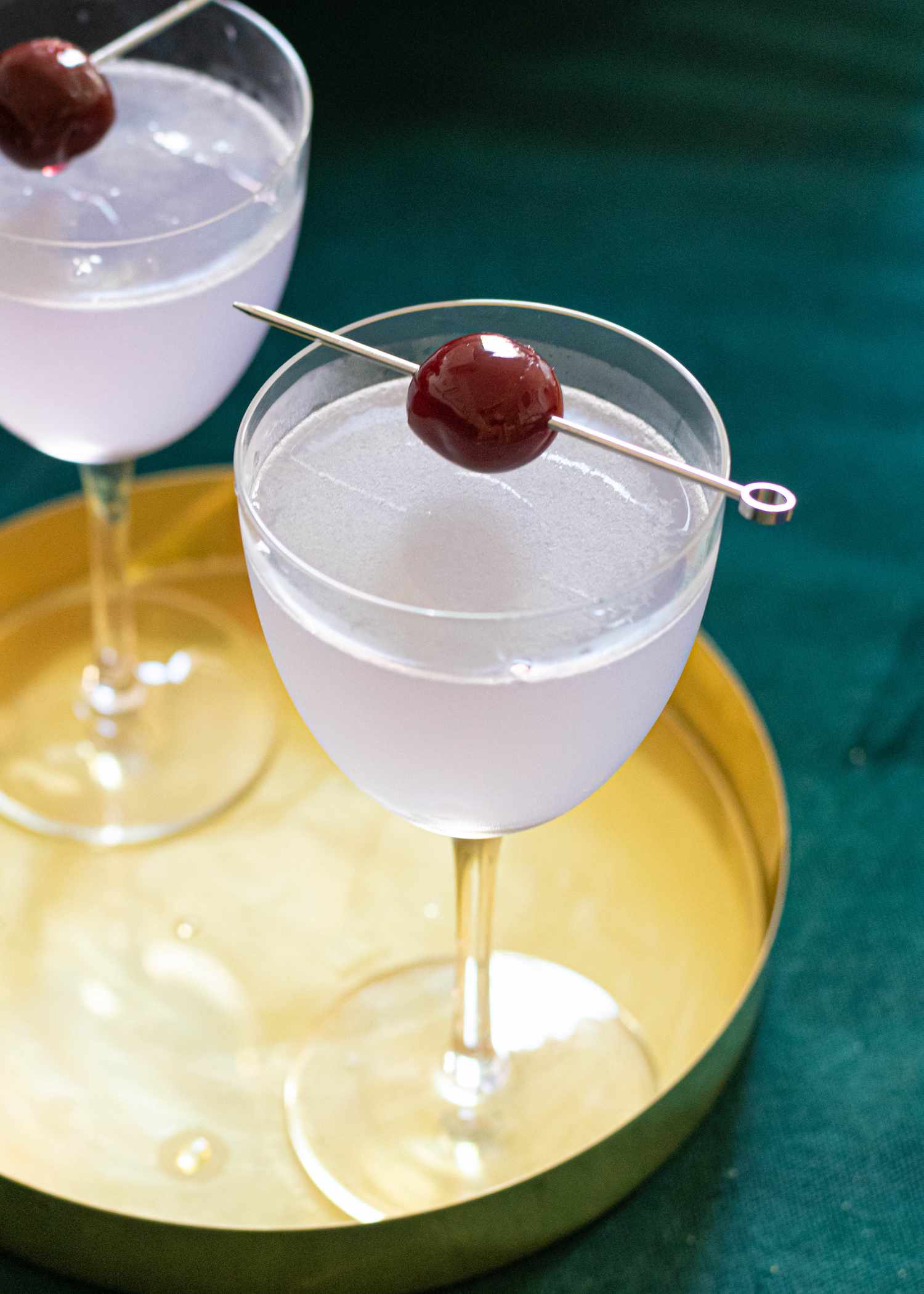 Aviation gin cocktail with cherry garnish