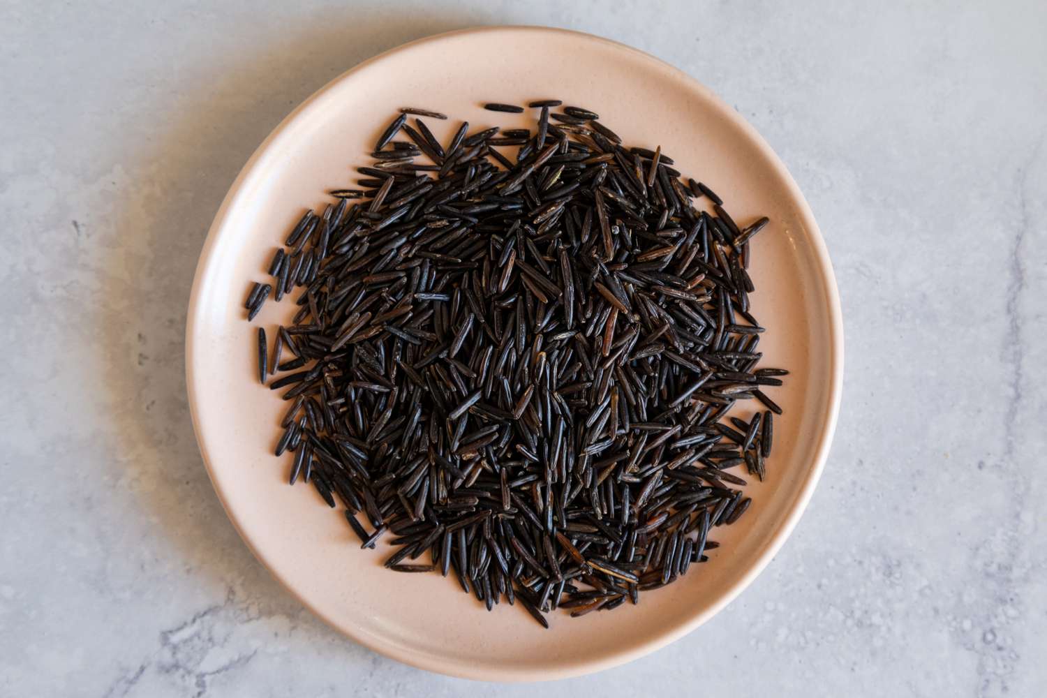 Wild rice on pink plate