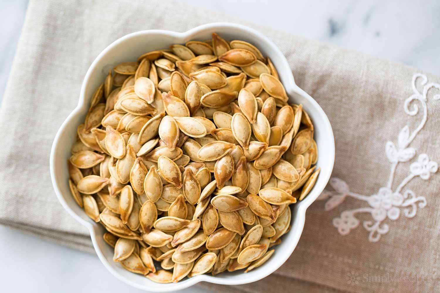 A bowl of roasted pumpkin seeds, ready to serve