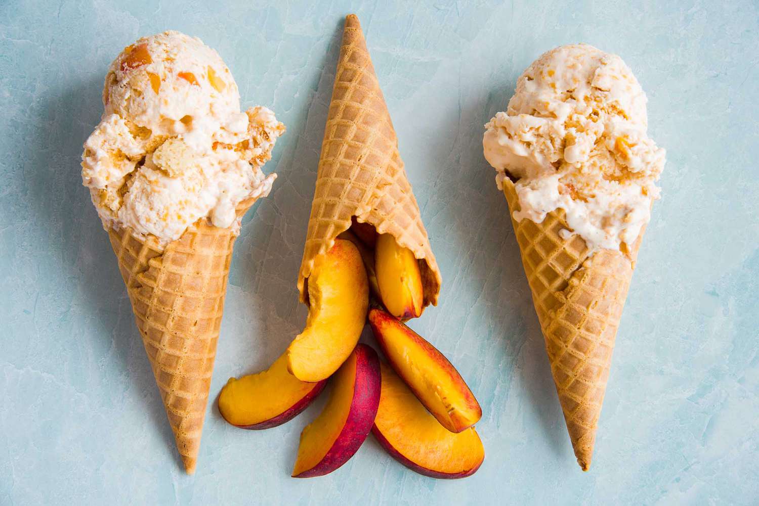 Three cones of no churn peach ice cream.