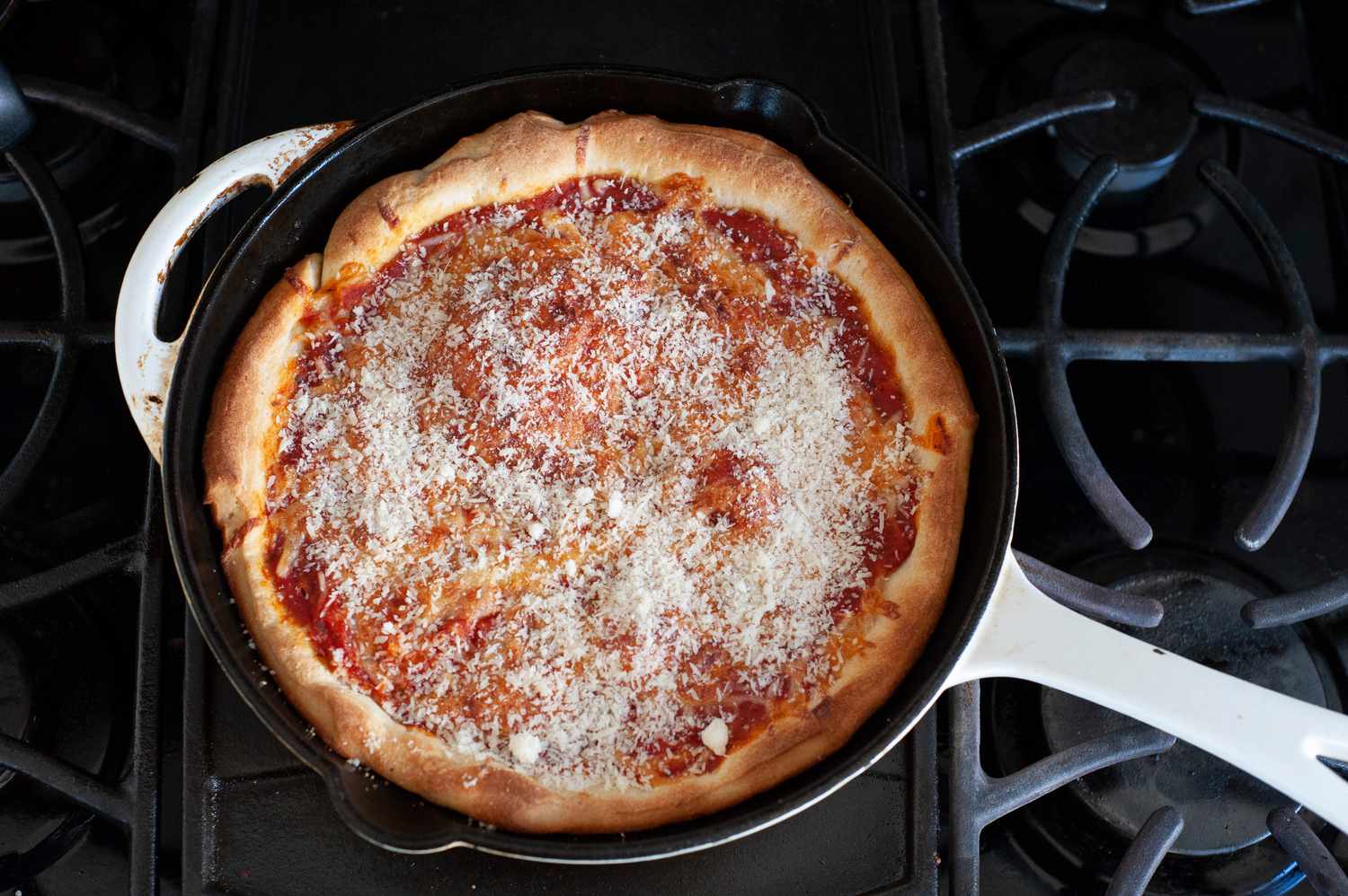 Top pizza with parmesan cheese.