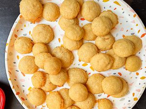 Homemade cheese puffs on a large serving plate