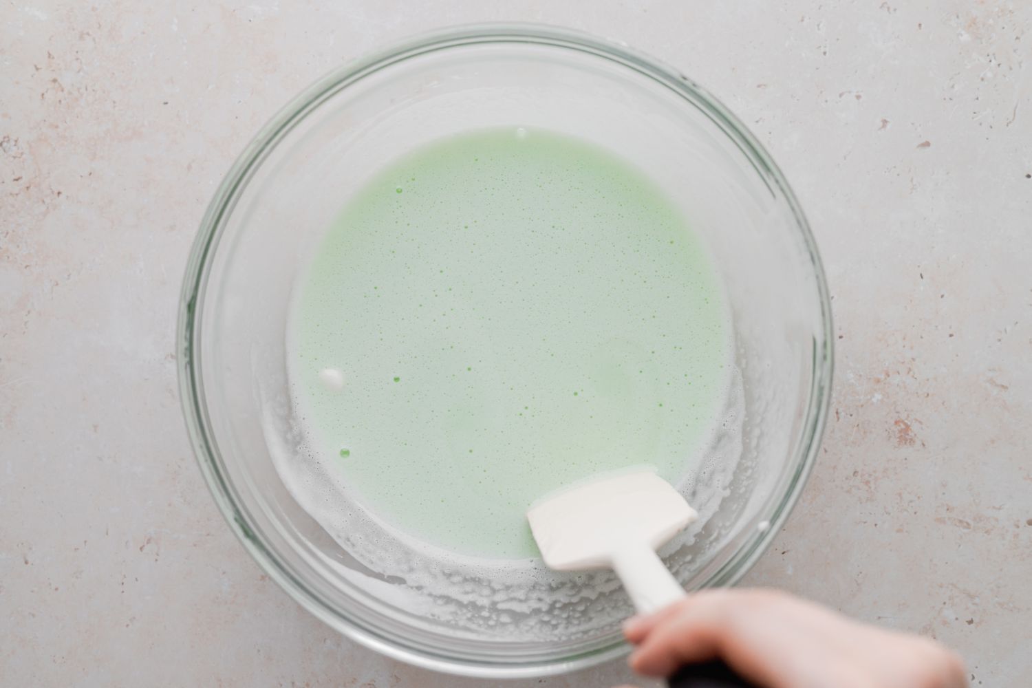 Stirring the filling for a grasshopper pie recipe.