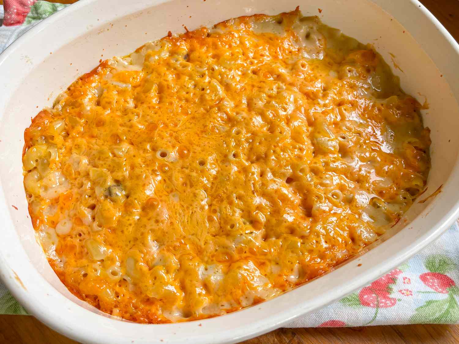 A very cheesy looking mac and cheese in a baking dish