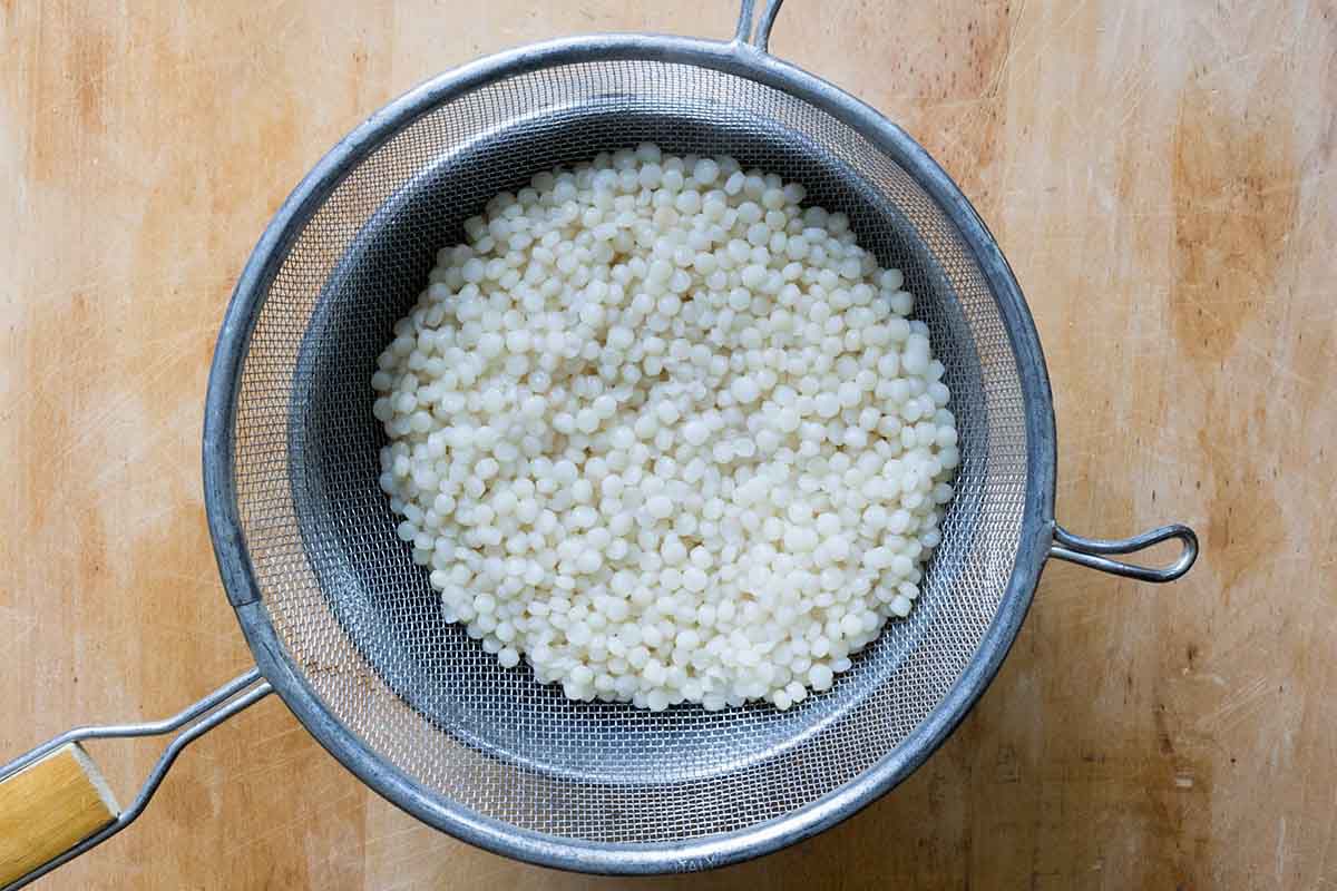 Small pasta draining in a colander to make wedding soup.