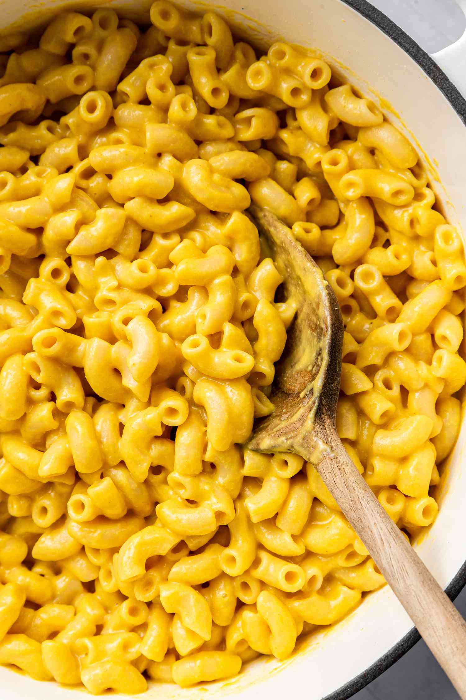 Pot of Vegan Mac and Cheese with a Wooden Spoon