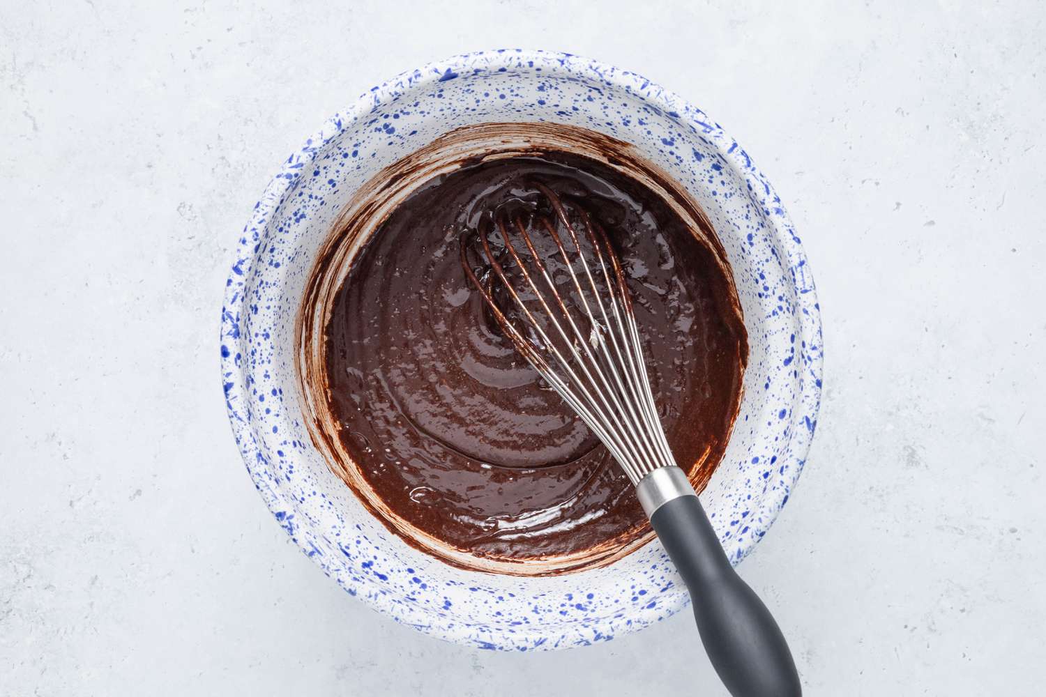 Chocolate mixture whisked into the egg mixture for homemade cosmic brownies recipe
