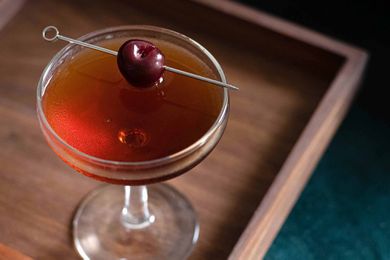 Manhattan cocktail with cherry garnish