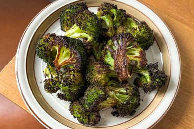 A plate with roasted broccoli florets