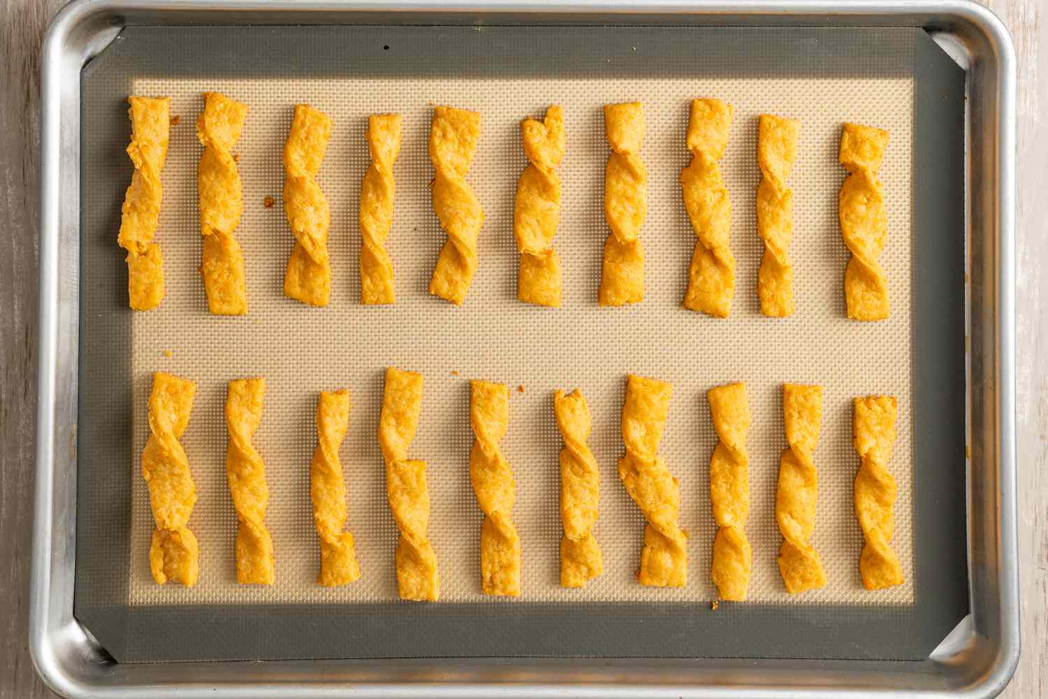 Lined Baking Tray with Baked Twisted Cheese Straws