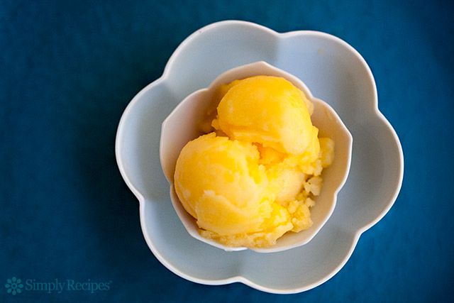 tangerine sorbet in decorative white bowl